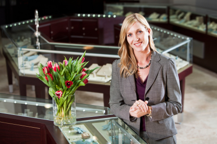 Jewelry store owner at the display counter